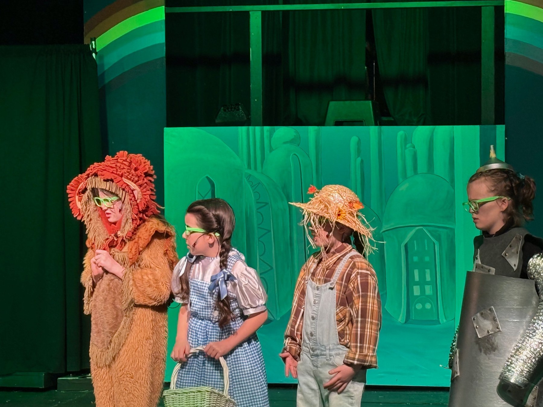 Wizard of Oz cast members on stage